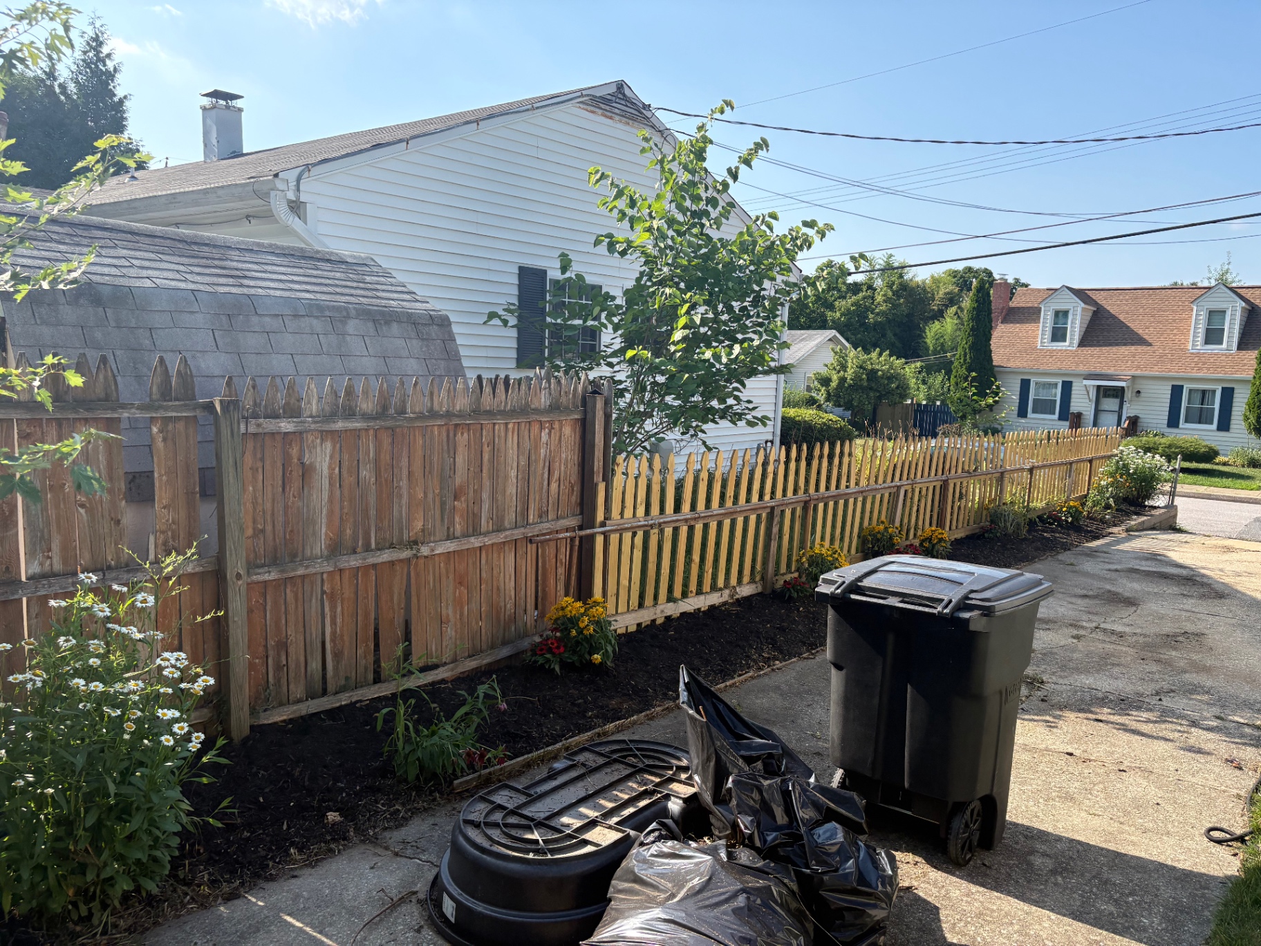Weed removal and fresh flower bed after