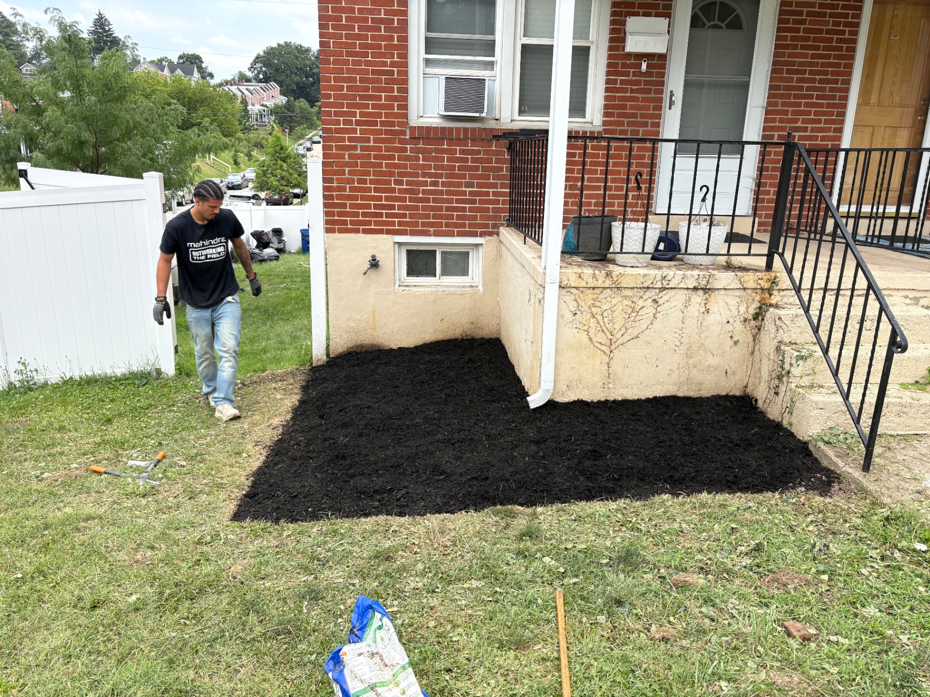 Overgrown bed cleared and mulched after