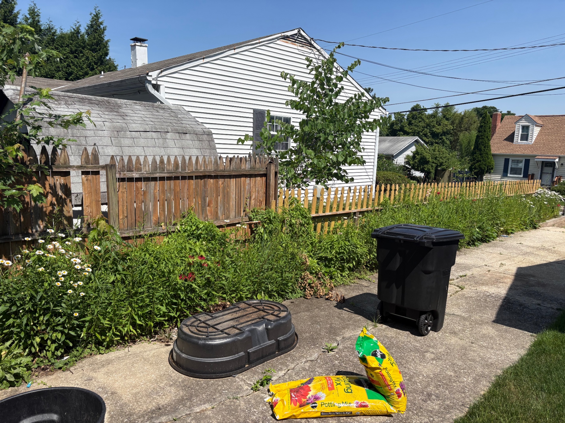 Weed removal and fresh flower bed before